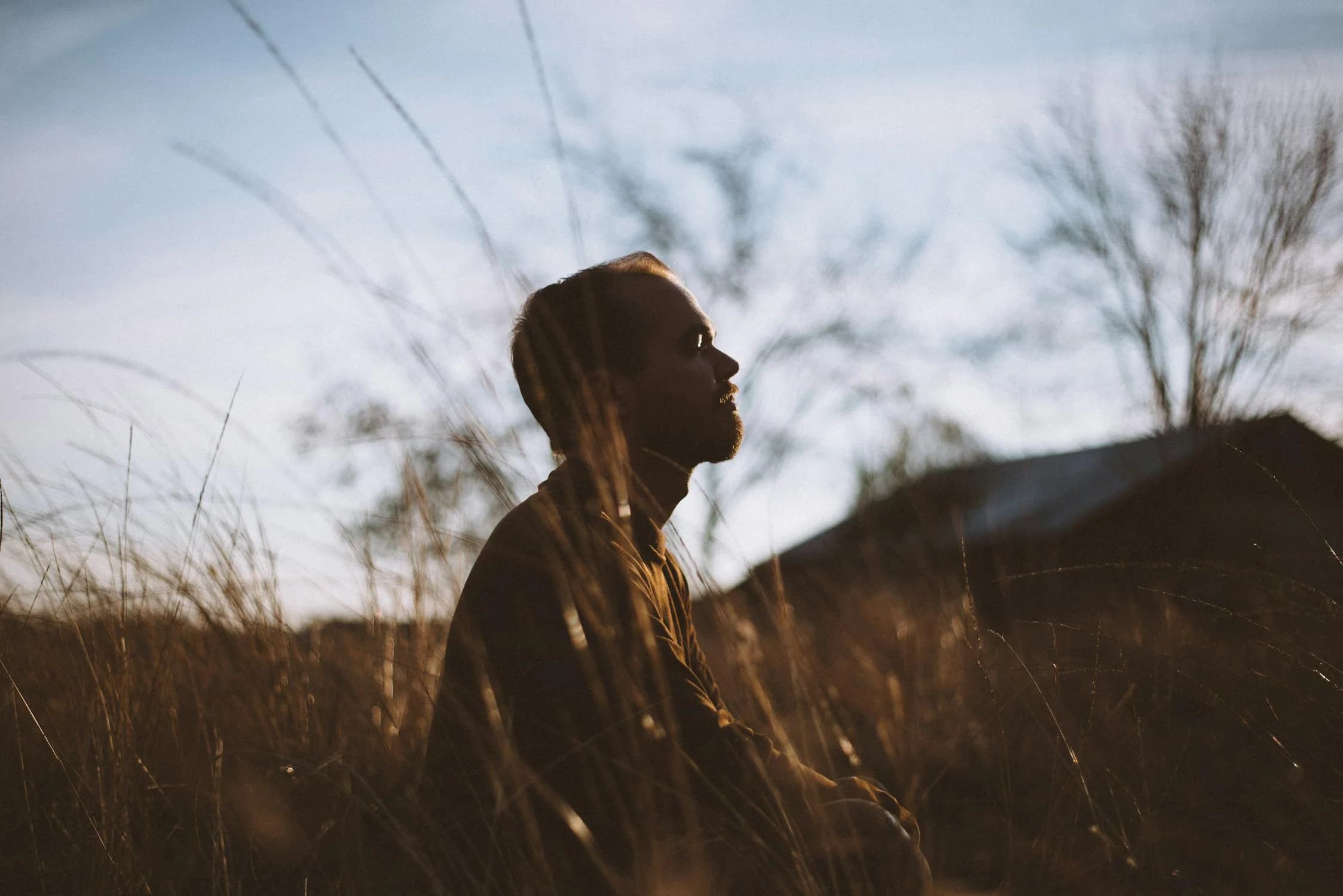 A man meditating outside